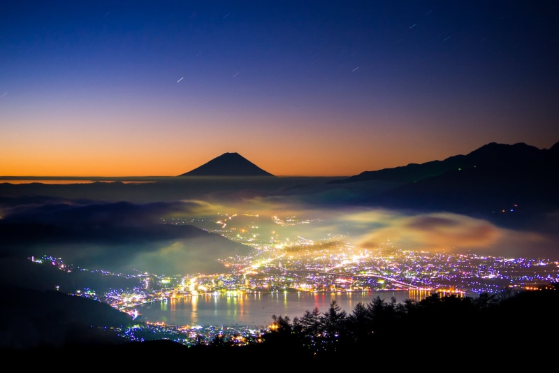 scenics - nature, the island of Honshu, nature, building exterior, sky, sunset, illuminated, beauty in nature, mountain, Japan, the evening, cityscape