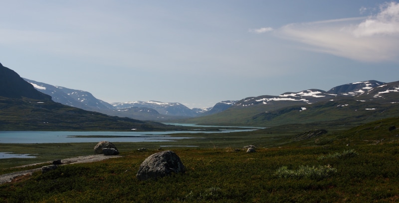 cold temperature, landscape, sky, kungsleden, snow, snowcapped mountain, wasteland, water, cloud - sky, beauty in nature, sea, grass, land, outdoors, animal wildlife
