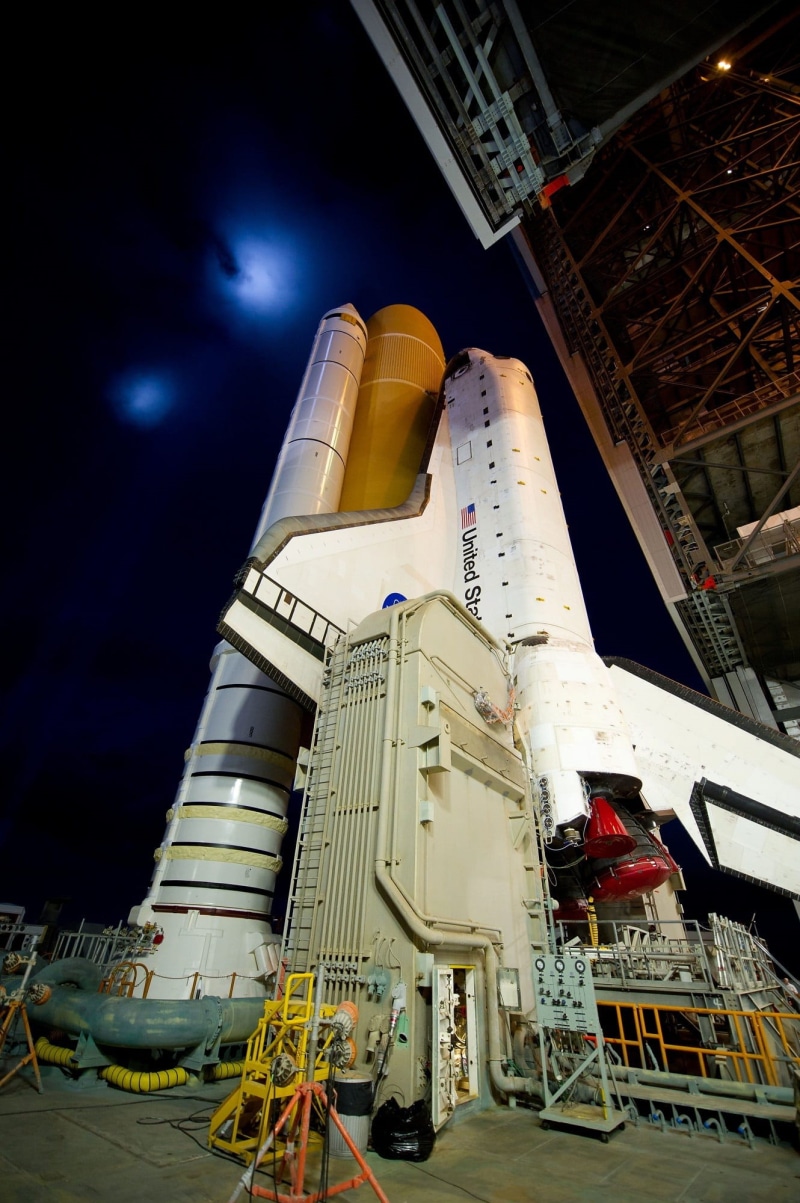 office building exterior, tourism, nature, flight, night, rocket, space, mission, skyscraper, outdoors, travel destinations, pre-launch, white, atlantis space shuttle