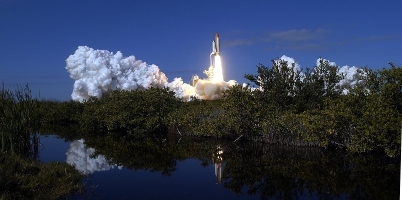 architecture, night, final liftoff, reflection, clouds, 1080P, orbit, environment, blue, blast off, water, outdoors, built structure, sky, no people, rockets