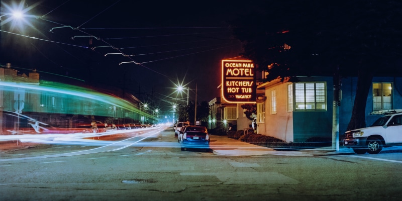 car, cars, light, street, streetscape, motion, text, illuminated, architecture, film, long exposure, office building exterior, muni, neon, no people, skyscraper