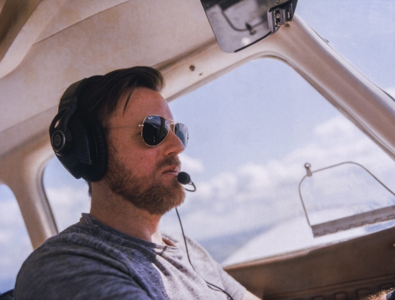 transportation, mode of transportation, portrait, sportplane, fashion, adult, mid adult men, hasselblad 201f, 50mm, cockpit, outdoors, 50mm f/2.8, sunglasses