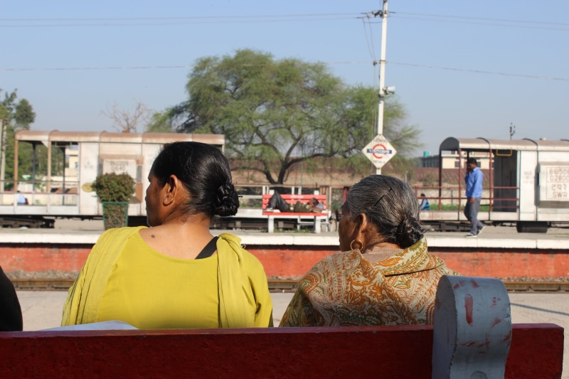sitting, real people, people, women, adult, built structure, lifestyles, architecture, railway station, religion, nature, men, ladies, building exterior