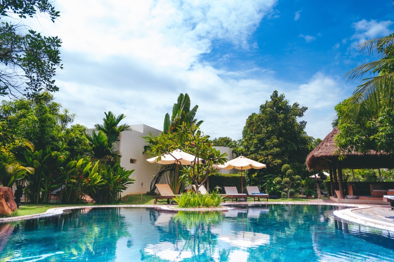 sky, pool, cloud - sky, no people, jar, trip, umbrellas, building exterior, hut, plant, poolside, patio, house, luxury, day, 4K, chair, built structure