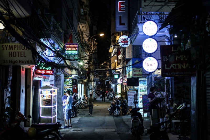 non-western script, standing, building exterior, vietnam, group of people, shopping, architecture, the way forward, outdoors, pho, illuminated, script