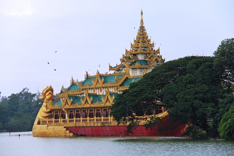 spire, outdoors, day, Gold, Temple, building exterior, water, plant, sky, architecture, travel destinations, tree, built structure, Sunset, Beautiful, lake