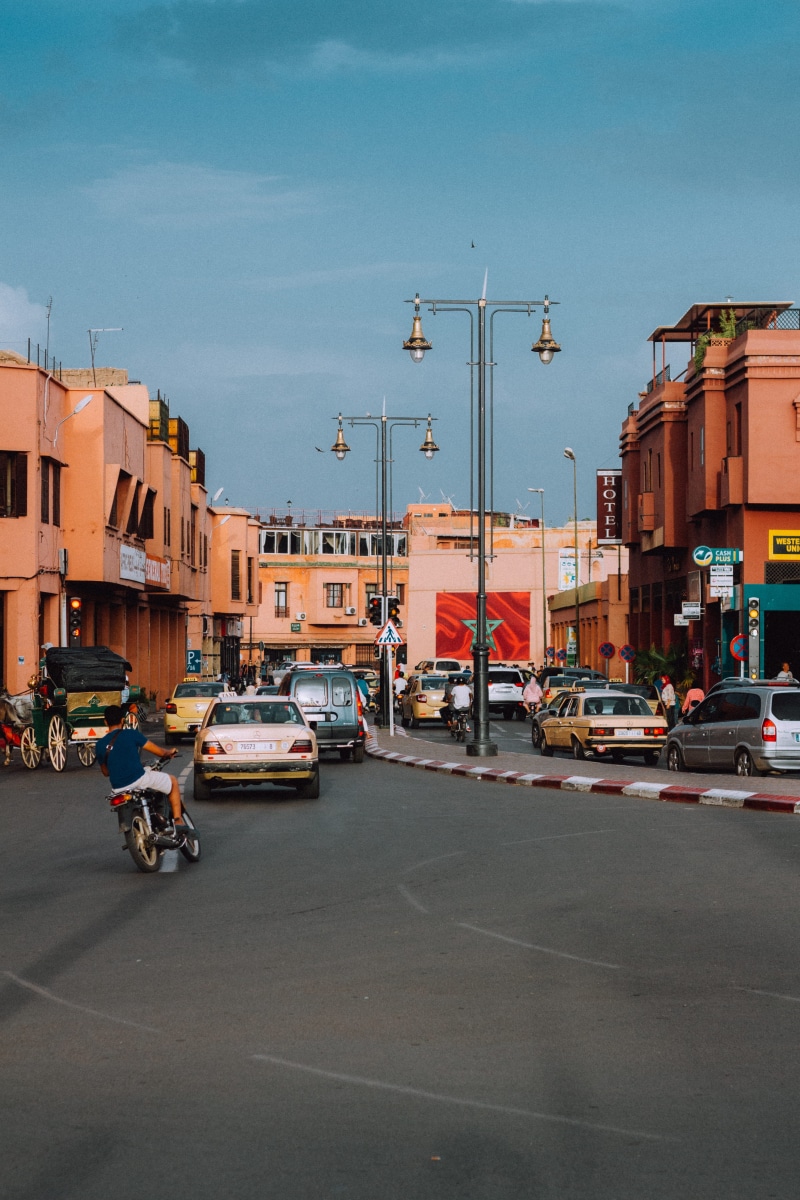marrakesh, nature, land vehicle, motor vehicle, built structure, outdoors, architecture, sky, street, building exterior, city life, incidental people, traffic