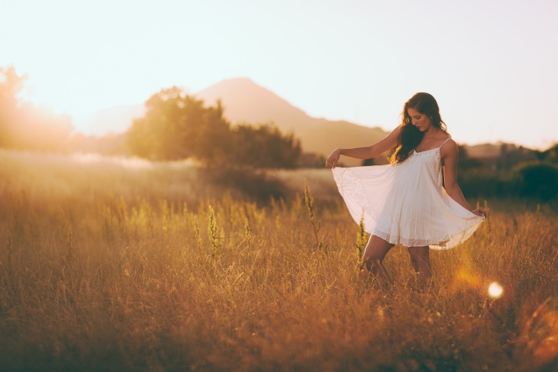 outdoors, young adult, leisure activity, full length, hairstyle, fashion, 1080P, white, field, standing, brunette, blonde, mountains, sky, gown, one person