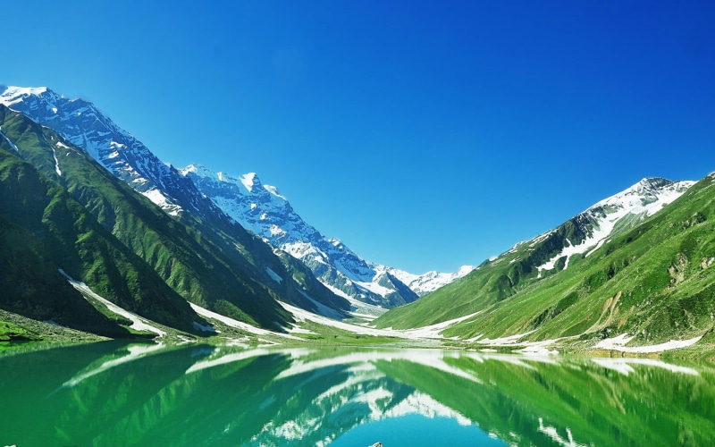 grass, sky, day, tranquility, water, lake saif ul malik, winter, mountain Range, sunlight, tranquil scene, hiking, valley, hill, snowcapped mountain, green Color