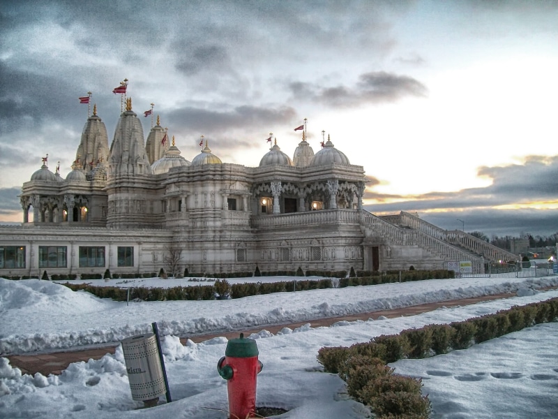 clouds, building exterior, nature, temple, cloud - sky, snow, built structure, cold temperature, shri swaminarayan mandir, architecture, day, canada, city