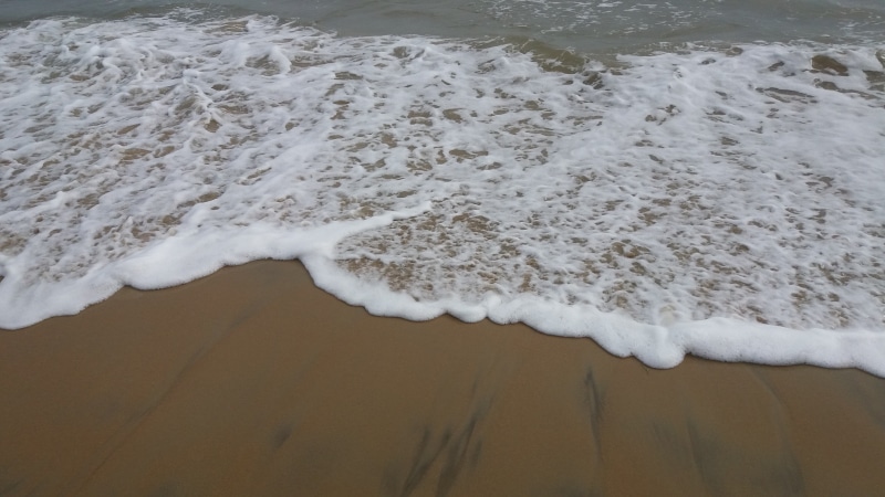 motion, sea, sport, beauty in nature, beach, flowing water, day, wave, beaches, reaching, sand, kanyakumari beach, india, aquatic sport, water, high angle view