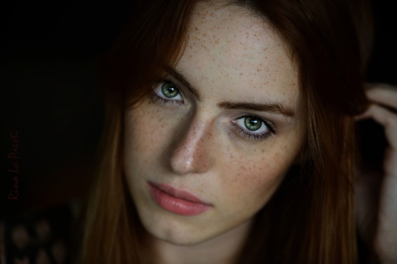 contemplation, young adult, human face, freckle, women, one person, body part, view, adult, eye, blue eyes, green eyes, looking at camera, black background