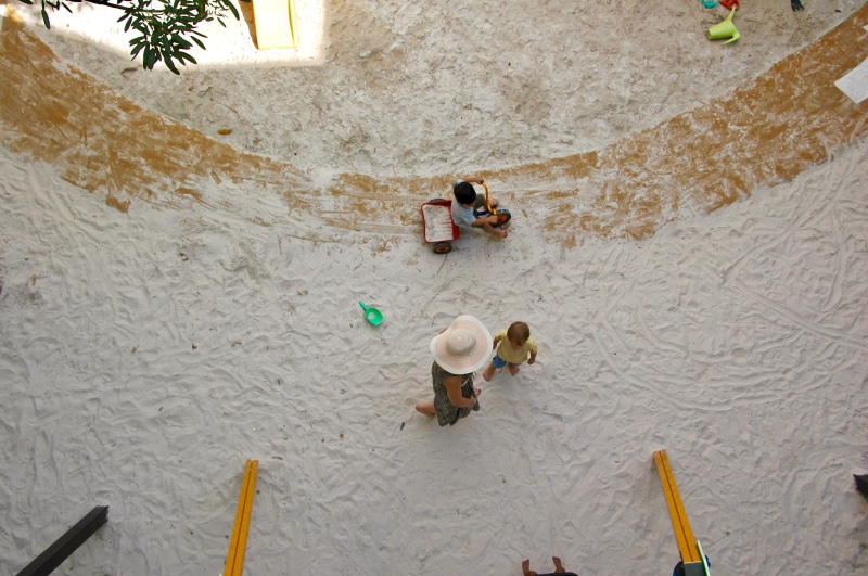 togetherness, high angle view, banister, helmet, tree, swimwear, outdoors, day, land, leisure activity, people, water, clothing, flagstone, childhood, lifestyles