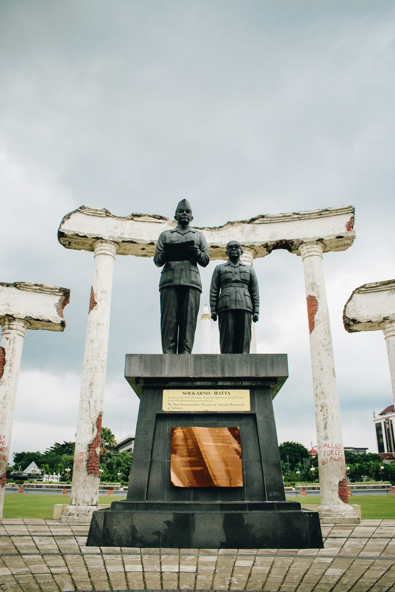 male likeness, column, apparel, person, architecture, religion, symbol, legend, clothing, human representation, sky, statue, representation, flagstone