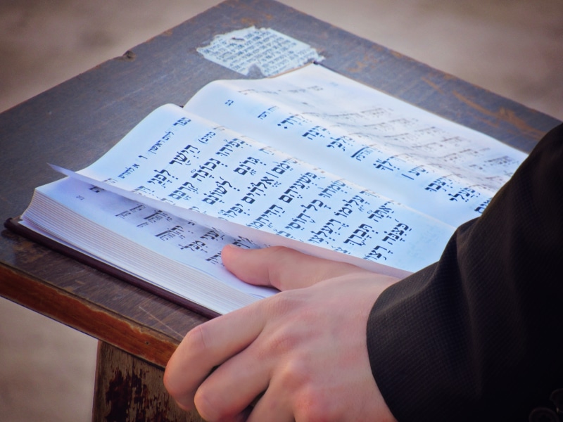 translations, preach, wall, sheet music, finger, religious, study, publication, spirituality, high angle view, israel, hebrew, reading, belief, church