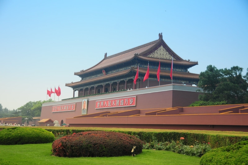 outdoors, travel, green color, grass hedges, growth, brown, no people, built structure, tiananmen square, tree, day, religion, building exterior, red flag