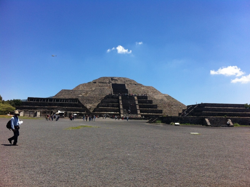 ruins, ancient, travel destinations, men, sky, built structure, teotihuacan, outdoors, cloud - sky, pyramid, building exterior, blue, archaeology, tourism