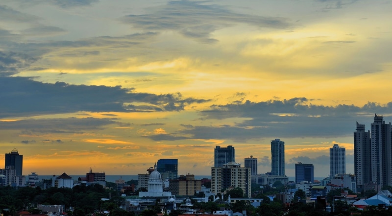 urban skyline, spire, orange color, landscape, sunset, high, no people, 1080P, cloud - sky, financial district, tower, sky, colombo, tall - high, building