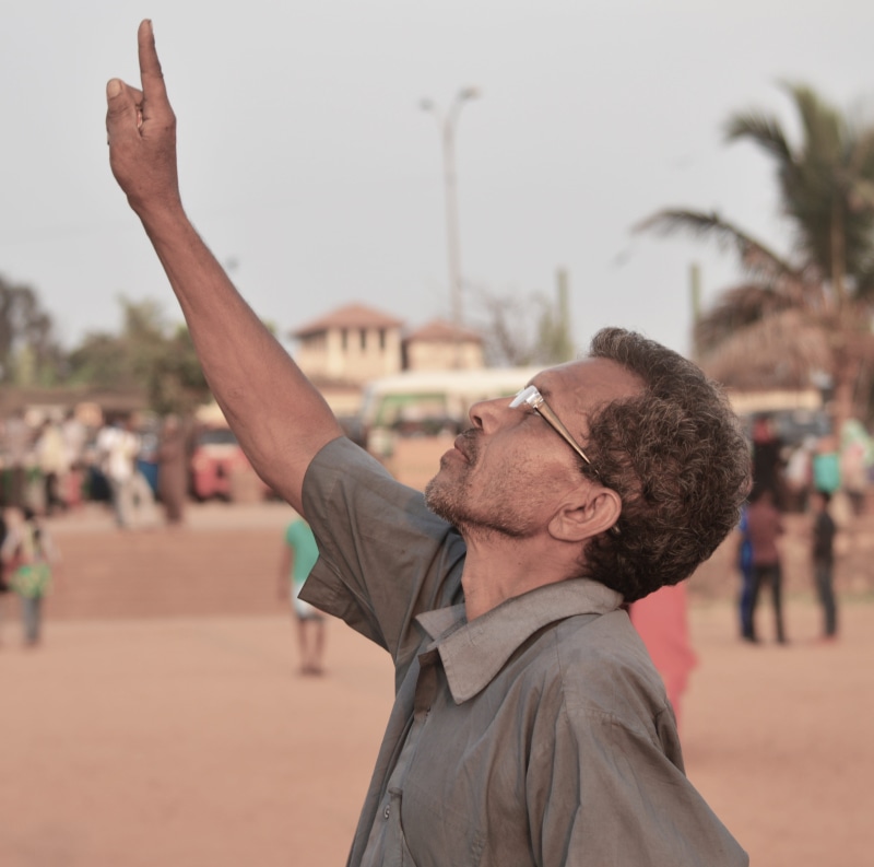 males, portrait, incidental people, gesturing, lifestyles, side view, human arm, adult, arms raised, People, Colombo, outdoors, Man, day, only men, Finger