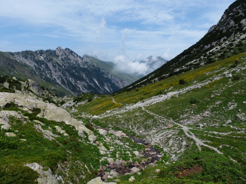 alpine, sky, nature, environment, grassy slope, flowing water, hike, outdoors, hiking, mountains, remote, rock, idyllic, gta, cloud - sky, no people, day