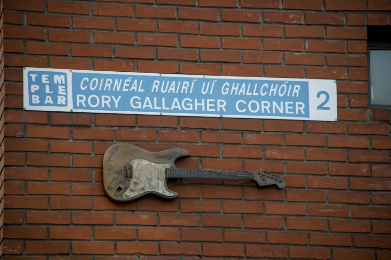 text, wall - building feature, temple, outdoor, information, architecture, dublin, rory gallagher corner, ireland, brick wall, bar, capital letter, outdoors