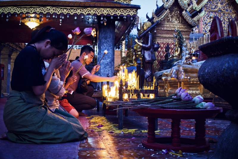crowd, religion, candle, bhudda, person, men, pray, bar counter, built structure, place of worship, pub, women, burning, people, worship, spirituality