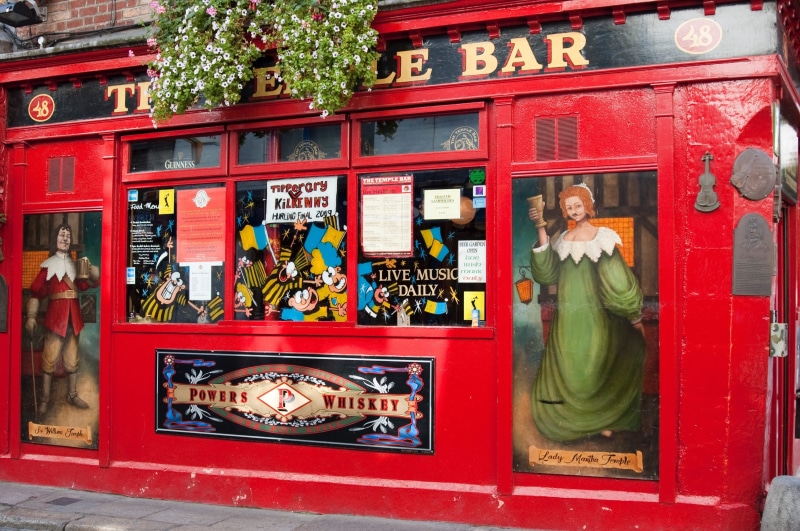 statue, male likeness, consumerism, spirituality, no people, architecture, Dublin, building exterior, text, art and craft, red, retail, representation