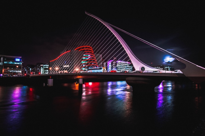 skyscraper, cityscape, bridge - man made structure, reflection, water, modern, neon, samuel beckett bridge, form, reflect, no people, night, building exterior