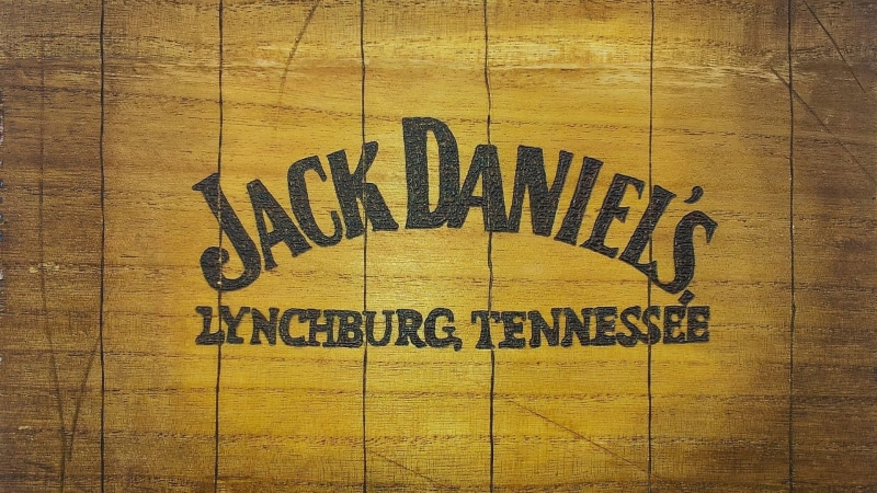 no people, wooden surface, wood, safety, logo, indoors, full frame, Tennessee, close-up, communication, USA, non-western script, brand, alcohol, sign, western script