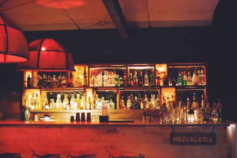 liquor, rack, collection, indoors, hard liquor, no people, assorted, alcohol, display, choice, shakers, bottle, bar counter, nightlife, night, bottles
