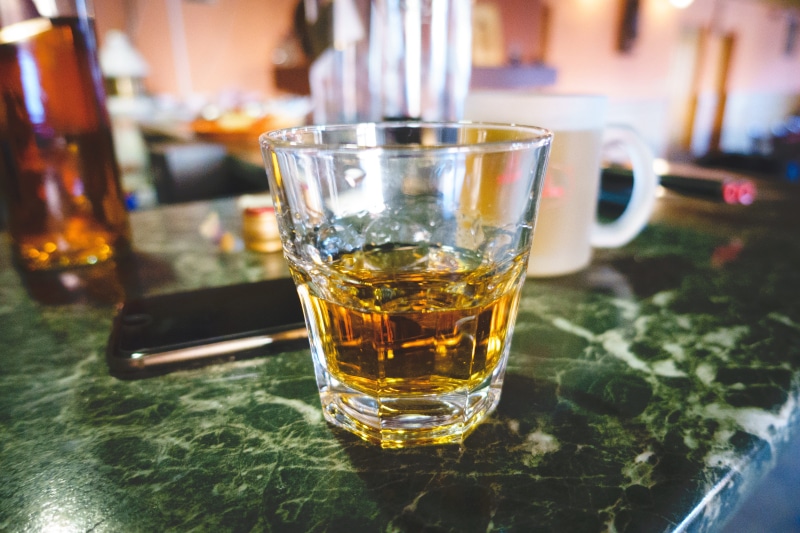 focus on foreground, whiskey, Shot, bar - Drink Establishment, indoors, bar Counter, pub, alcohol, still life, glass - Material, freshness, hard liquor