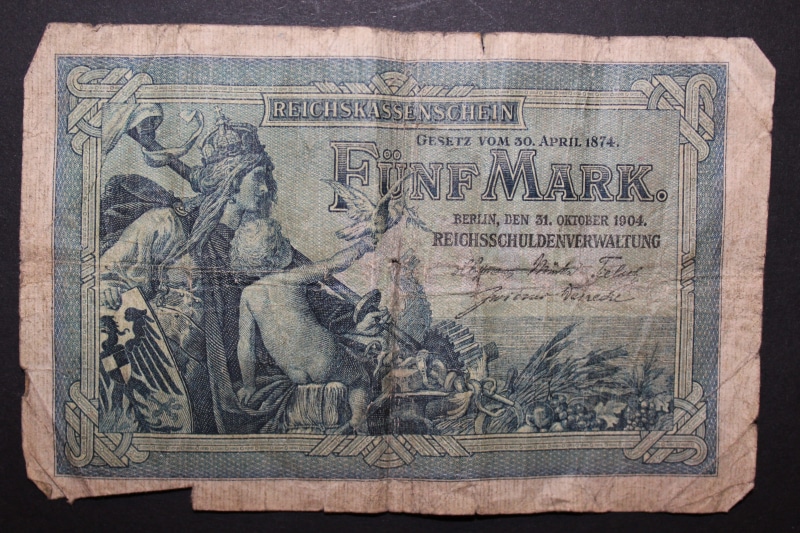 antique, five mark, funds, close-up, pay, weapon, art and craft, no people, text, bills, economy, history, architecture, day, studio shot, concepts And Ideas