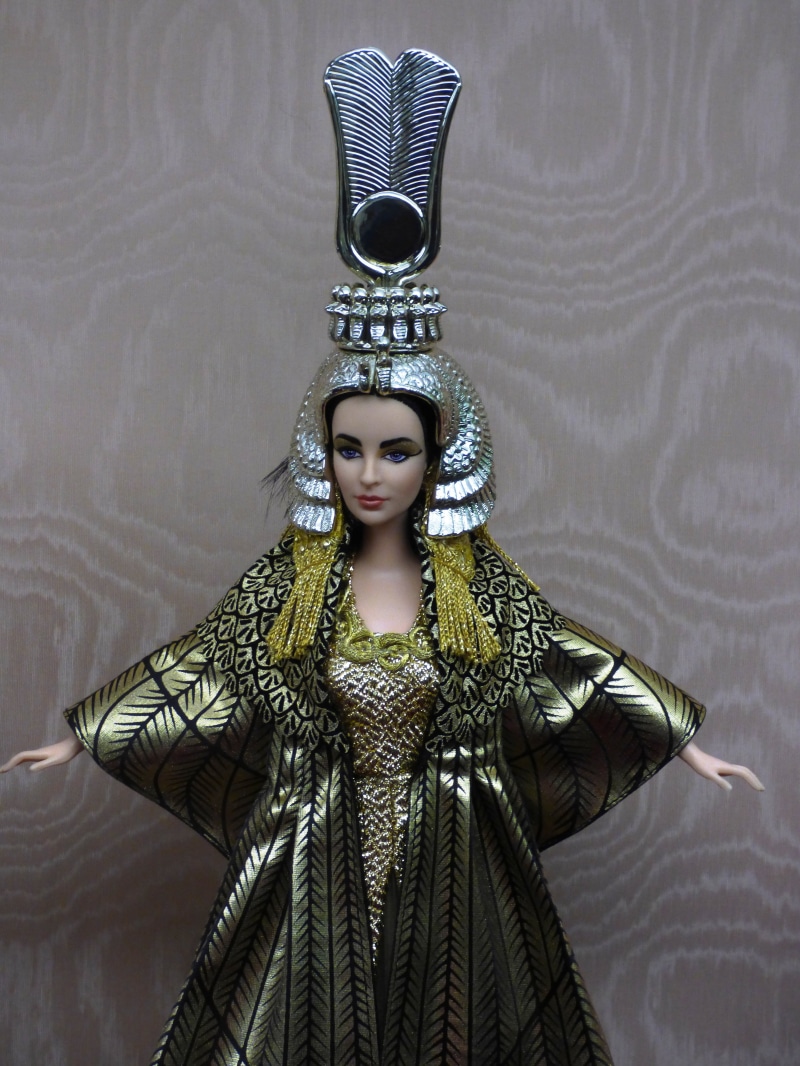 fashion, egypt, studio shot, human representation, crown, wall - building feature, character, headwear, hairstyle, costume, waist up, women, adult, occupation