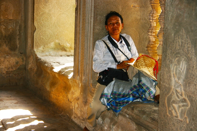 mature men, real people, female, architecture, women, traditional clothing, hinduism, men, thinking, window, cambodia, resting, males, culture, day, tradition