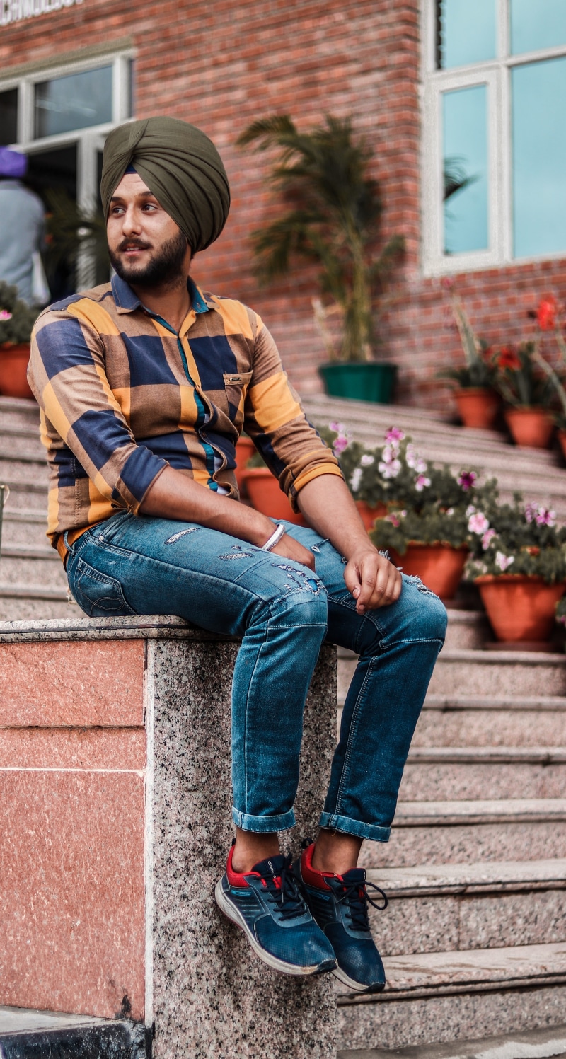 face, building exterior, human, young men, full length, real people, sitting, beard, sikh, teenager, black, person, architecture, contemplation, leisure activity