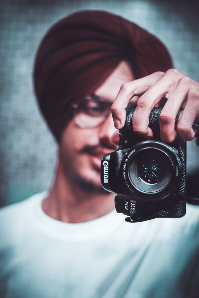 room, occupation, 77d, india, studio, lifestyles, film maker, digital camera, bokeh, holding, headshot, one person, chandigarh, 5K, focus on foreground