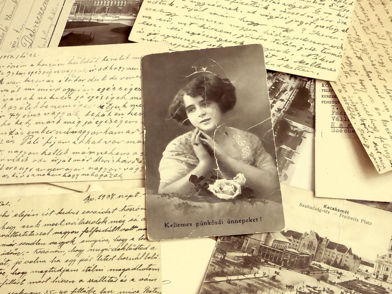 text, holding, history, correspondence, structure, indoors, lifestyles, rustic, real people, background, texture, the past, old, women, writing, porte