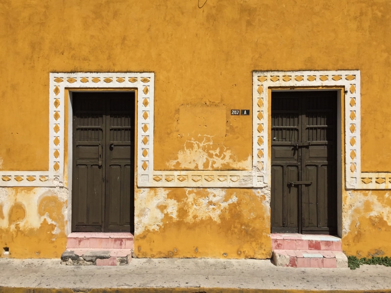 cobblestone, colonial, house, wall, yellow, mexico, geranium, shutter, old, two, hispanich, pueblo magico, door, no people, yucatan, window, d, izamal