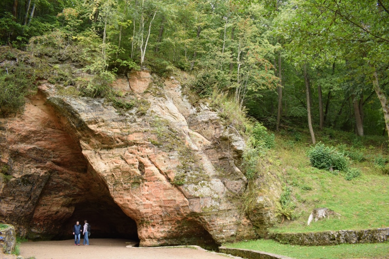 geology, national, cave, sigulda, tourism, sand, real people, beauty in nature, day, nature, earth, outdoors, travel, solid, lifestyles, rock formation
