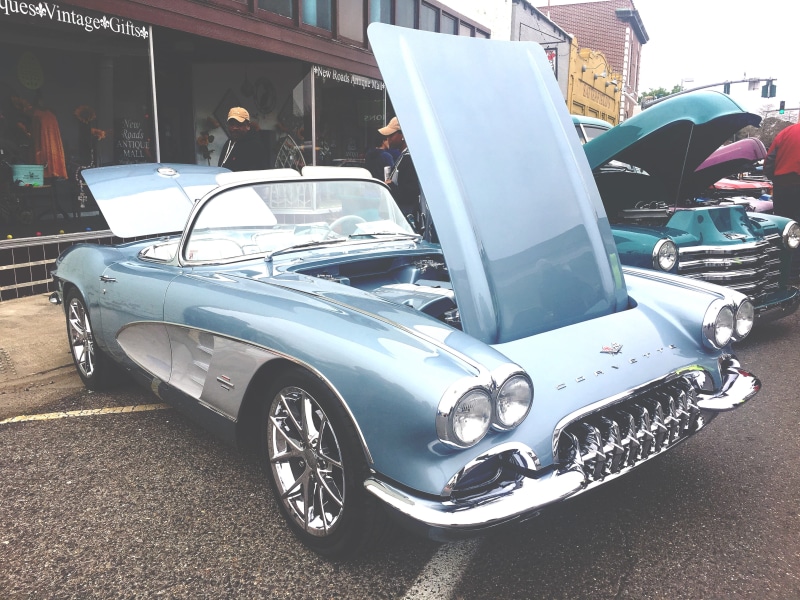 coupe, spoke, motor vehicle, road, incidental people, luxury, hot rod, person, automobile, blue, car show, 4K, vehicle, tire, car, outdoors, architecture
