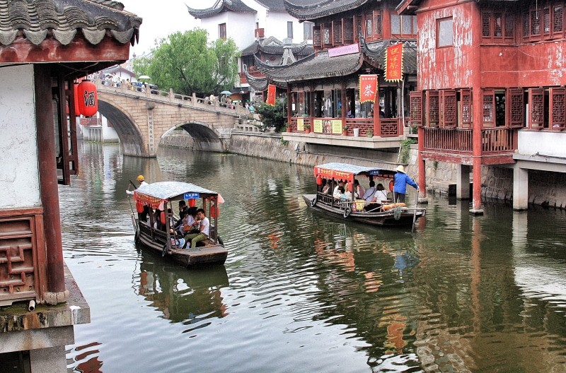 outdoors, qibao, building exterior, old town, 2K, mode of transportation, architecture, china, group of people, water, city, transportation, shanghai