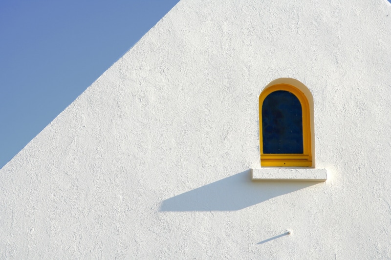 clean, low angle view, wall - building feature, built structure, yellow, day, minimal, sunlight, building exterior, blue, outdoors, closed, 2K, whitewashed