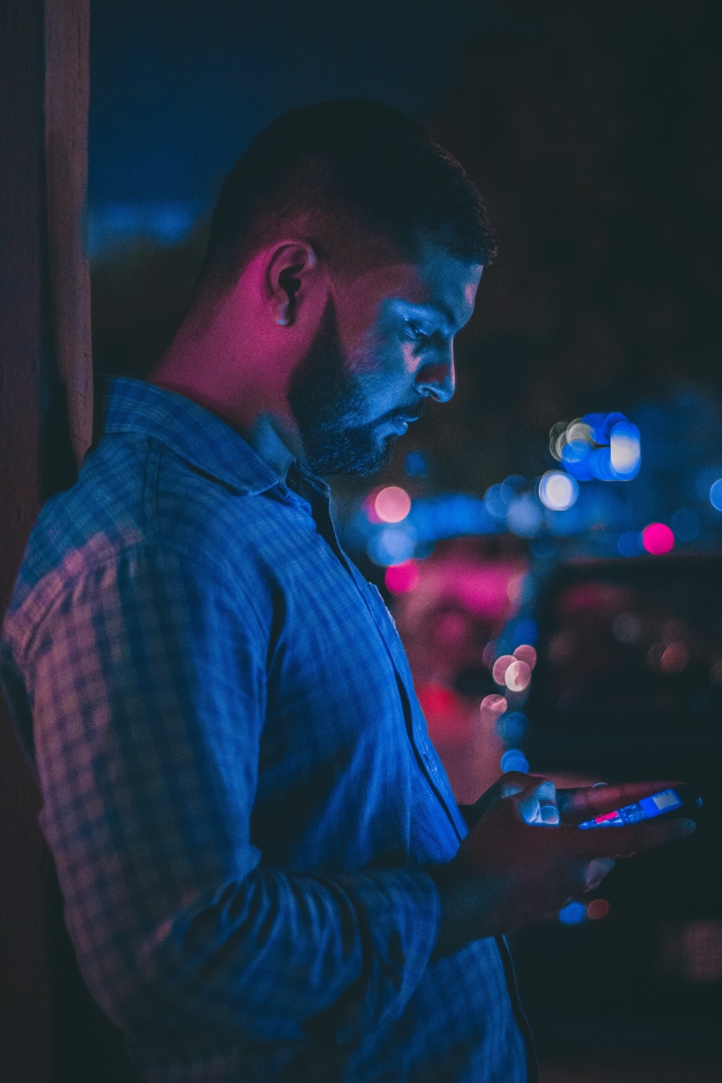men, standing, communication, mobile phone, leisure activity, casual clothing, side view, wireless technology, young adult, real people, young men, pakistan