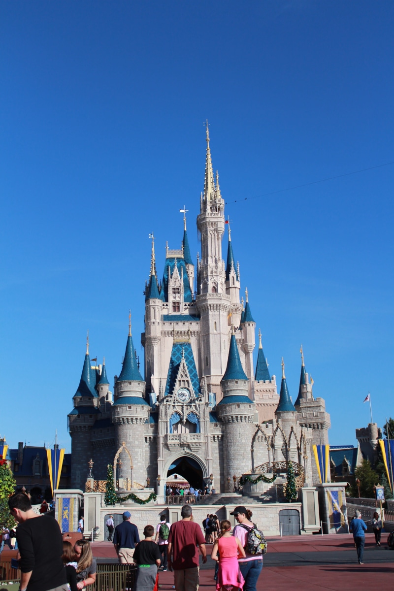 history, tourism, real people, Magic Kingdom, spire, belief, large group of people, theme park, daytime, building exterior, spirituality, building, blue