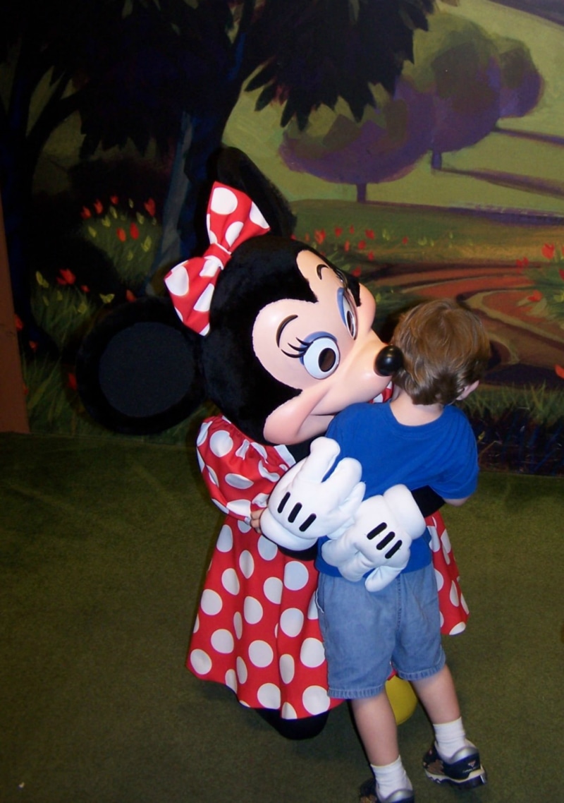 leisure activity, real people, one person, females, 2K, magic kingdom, innocence, minnie mouse, women, full length, disney, hug, males, boys, toy, cute