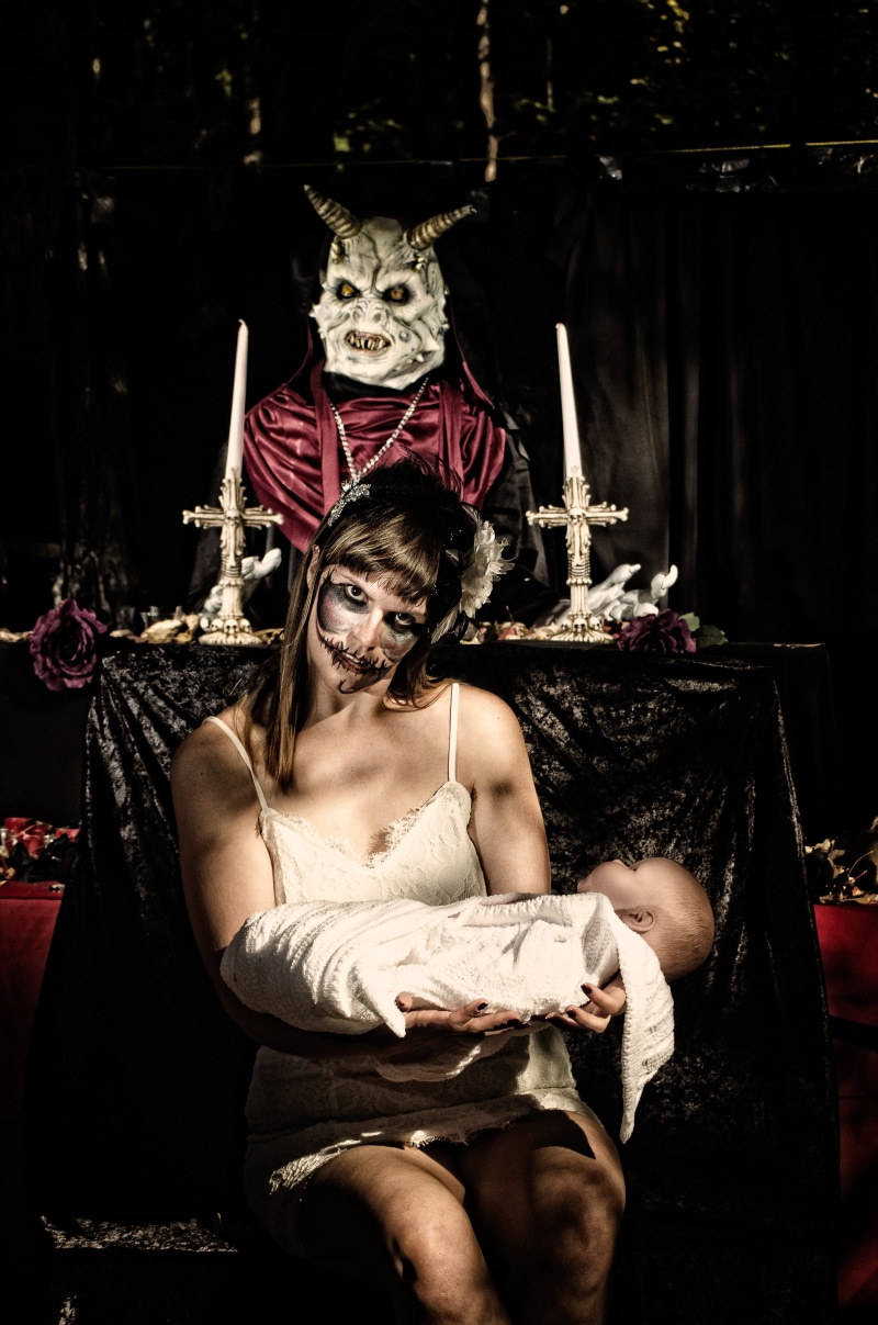 black, one person, lifestyles, nightmare, holiday - event, adult, real people, celebration, demon, death, costume, sitting, portrait, holding, monster