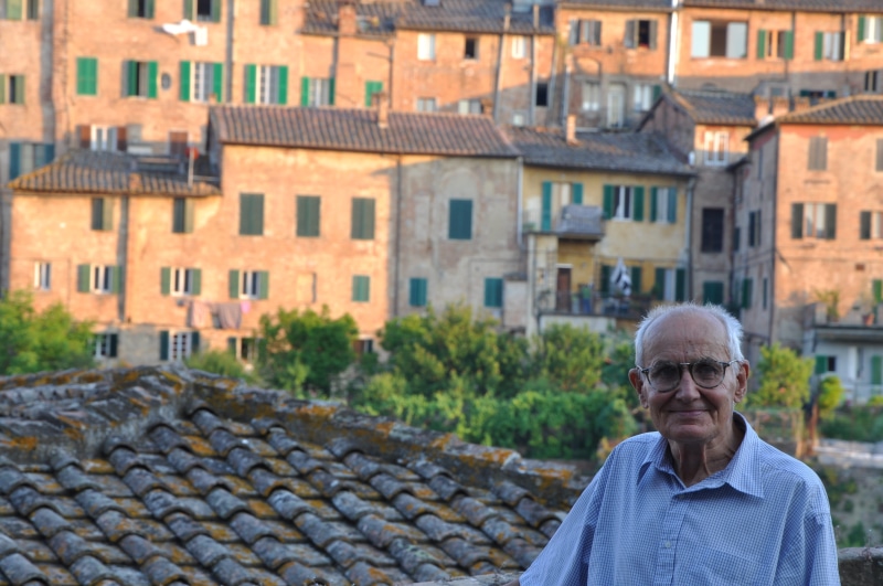 portrait, siena, province of siena, italian, building exterior, italy, front view, standing, man, day, glasses, architecture, headshot, males, one person