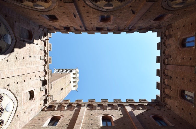 built structure, window, travel, travel destinations, blue, building exterior, sky, low angle view, 5K, sunlight, architecture, province of siena, clear sky