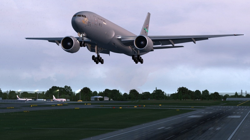 air vehicle, sky, landing - touching down, Boeing 777, airport runway, cloud - sky, airplane, road, nature, journey, transportation, aircraft, mid-air