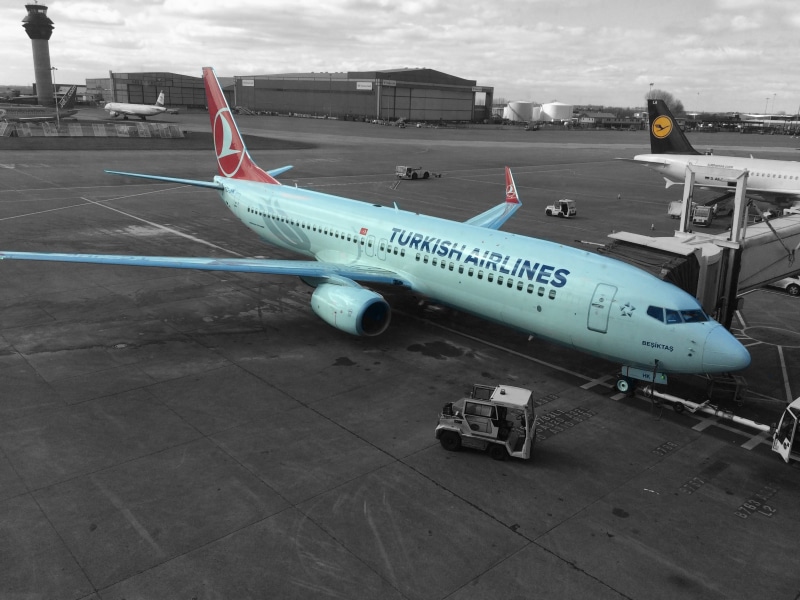 day, airport, land vehicle, jet engine, passenger jet, turkish airlines, airport runway, transportation, stationary, sky, manchester airport, aeroplane